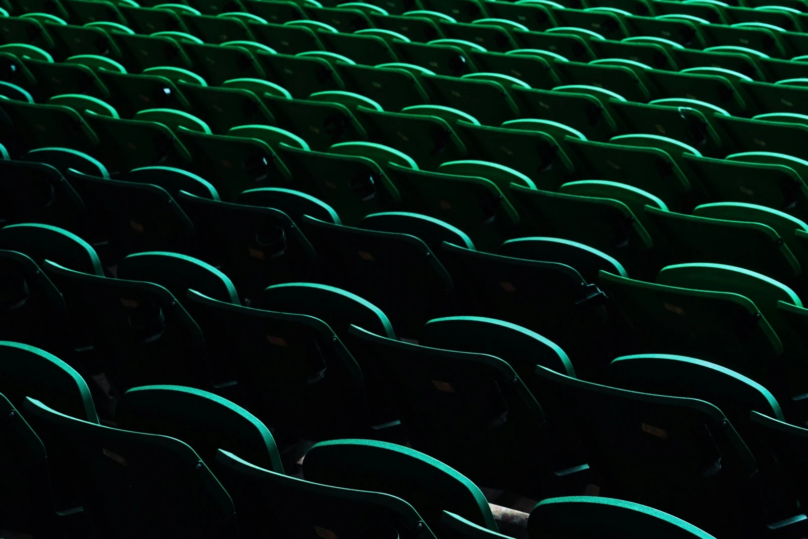 Rows of green event seats representing energy PR communications and audience engagement at Reset Connect.